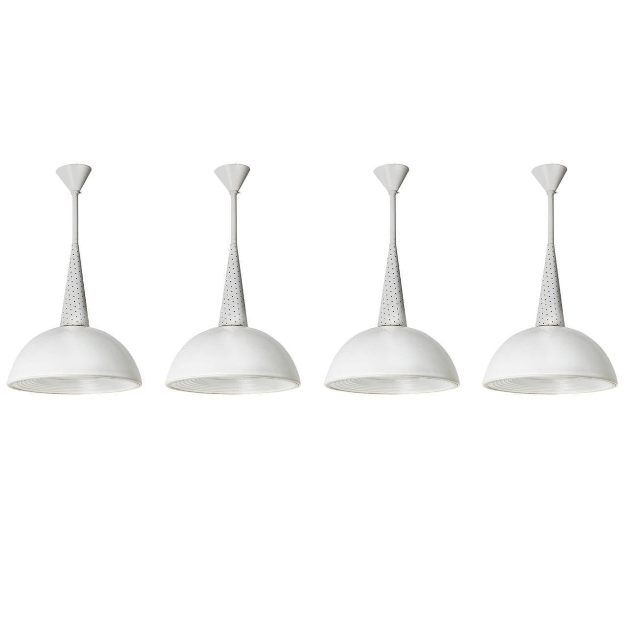 Four pendant lights in enameled metal and opaline.
Four pendant lights designed my Mathieu Matégot, France, circa 1950s. Opal glass shade with clear textured glass diffuser and lacquered aluminum. 
Original paint. Marked on glass: Made in France.