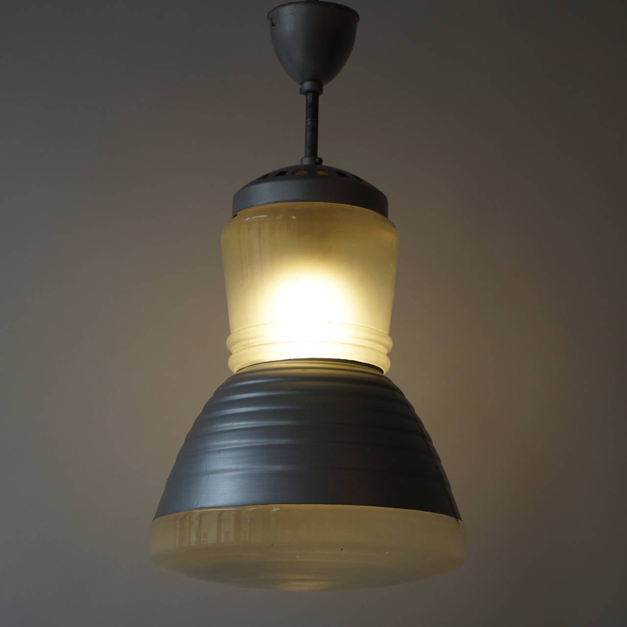Set of four Industrial pendant lights.
The hanging lamps are used in a church in the east of Holland.