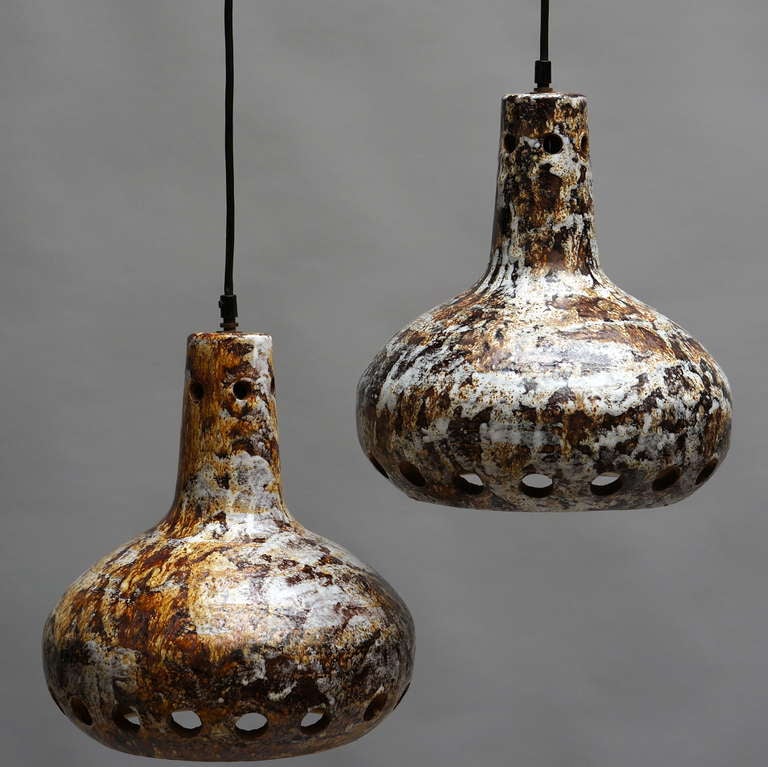 Pair of beautiful hand-sculpted ceramic pendant lamps.
Measures: Diameter 30 cm.
Height 32 cm.