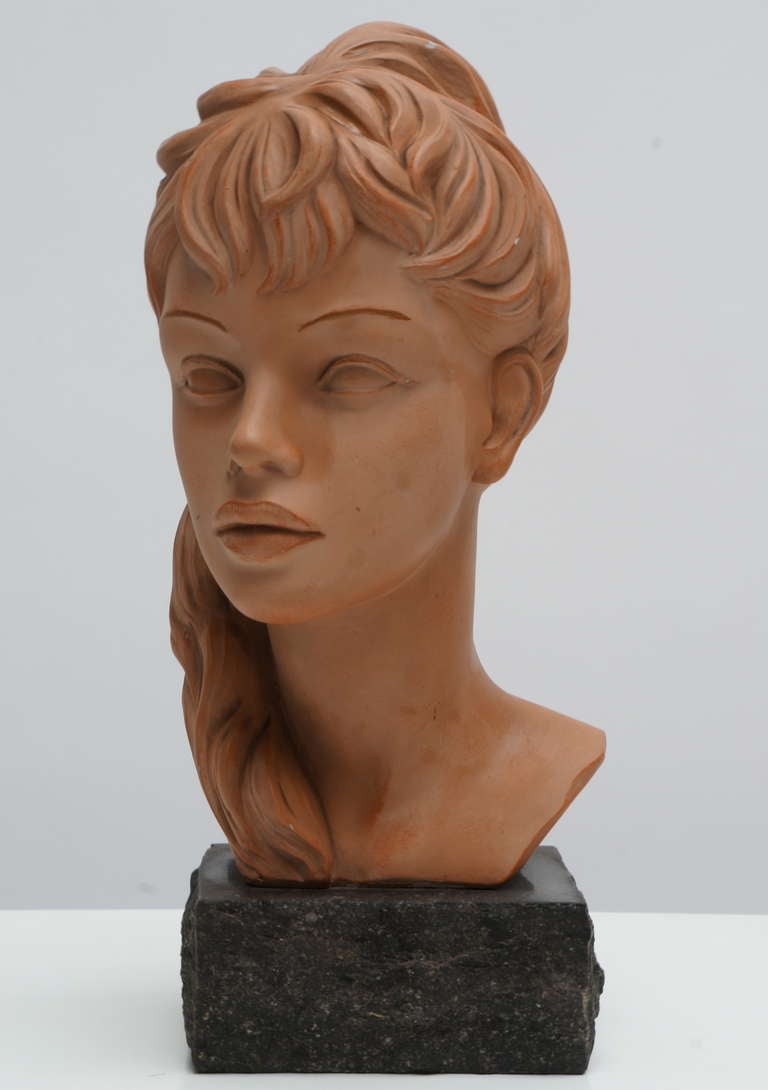 A beautiful terracotta bust of Brigitte Bardot by Italian sculptor Salvatore Melani.

An elegant bust of a young lady, clearly based on Brigitte Bardot.The bust is attached to a very nicely made granite base, and signed to the back R.I. 264 B.B.
