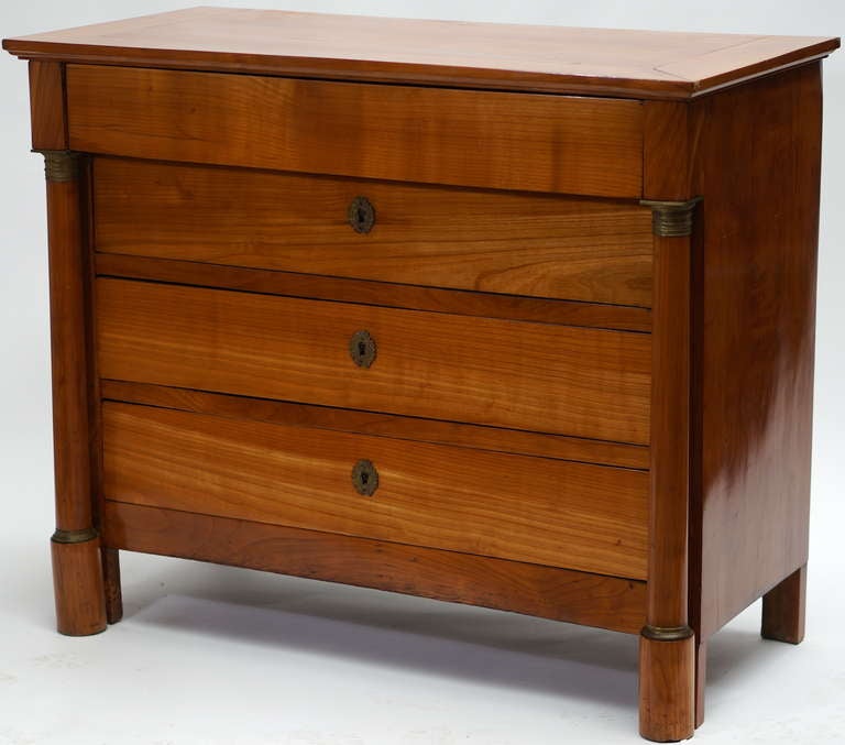 Early 19th century French chest of drawers in solid cherrywood. This piece has clean lines and a beautiful warm patina that would work in most styles of decor. It would make a perfect dresser in a guest room. The design possibilities are