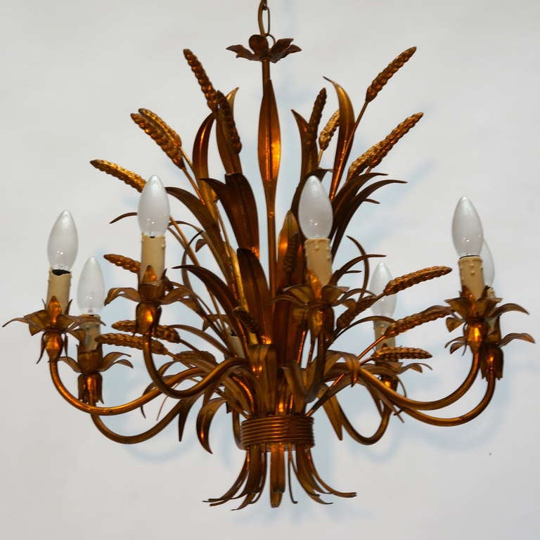 One of two French brass leaf-form chandeliers.
Diameter:65 cm.
Height:55cm.