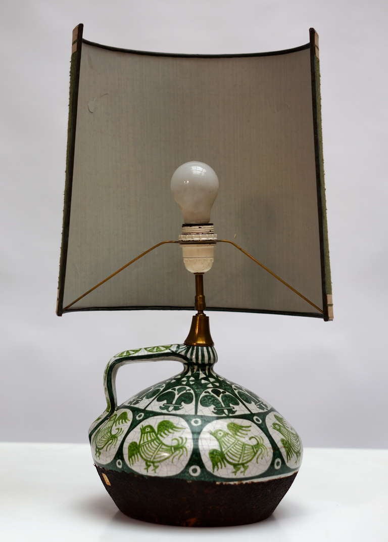 Italian table lamp, Ceramicas Olarca.
Diameter:34 cm.
Height:60 cm
The shade of the table lamp is adjustable.
The leather at the base of the ceramic table lamp has been damaged in several places.(see pictures)
