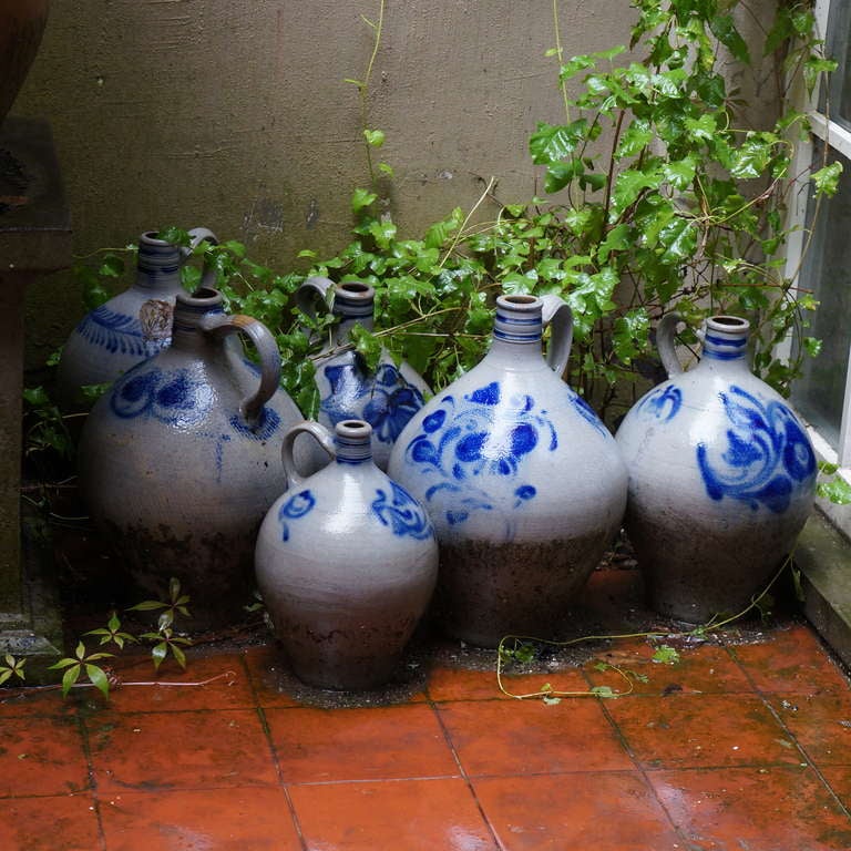 A collection of six salt glazed stoneware jugs decorated in blue patterns.
Alsace, France, late 19th century.
Height:40 cm.
Diameter:30 cm.