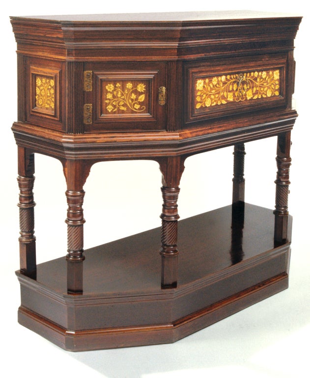 Made and signed by Collinson & Lock, this exquisitely crafted rosewood cabinet features delicate and quite elaborate intarsia inlay. The inlay and its intricate engraved penwork were undoubtedly done by Stephen Webb, a sculptor who joined Collinson