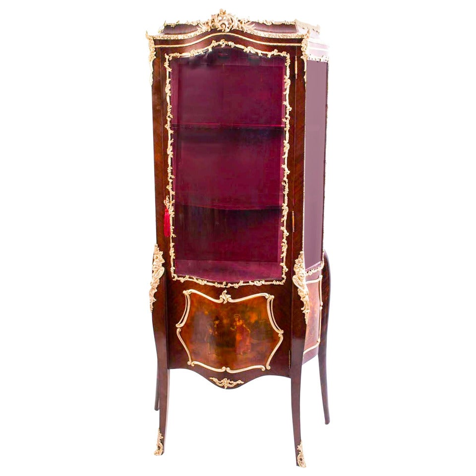This is a striking antique French Vernis Martin gonzalo alves and mahogany serpentine vitrine in the Louis XV manner, late 19th century in date. 

This beautiful cabinet has three beautifully hand painted panels typical of Vernis Martin furniture