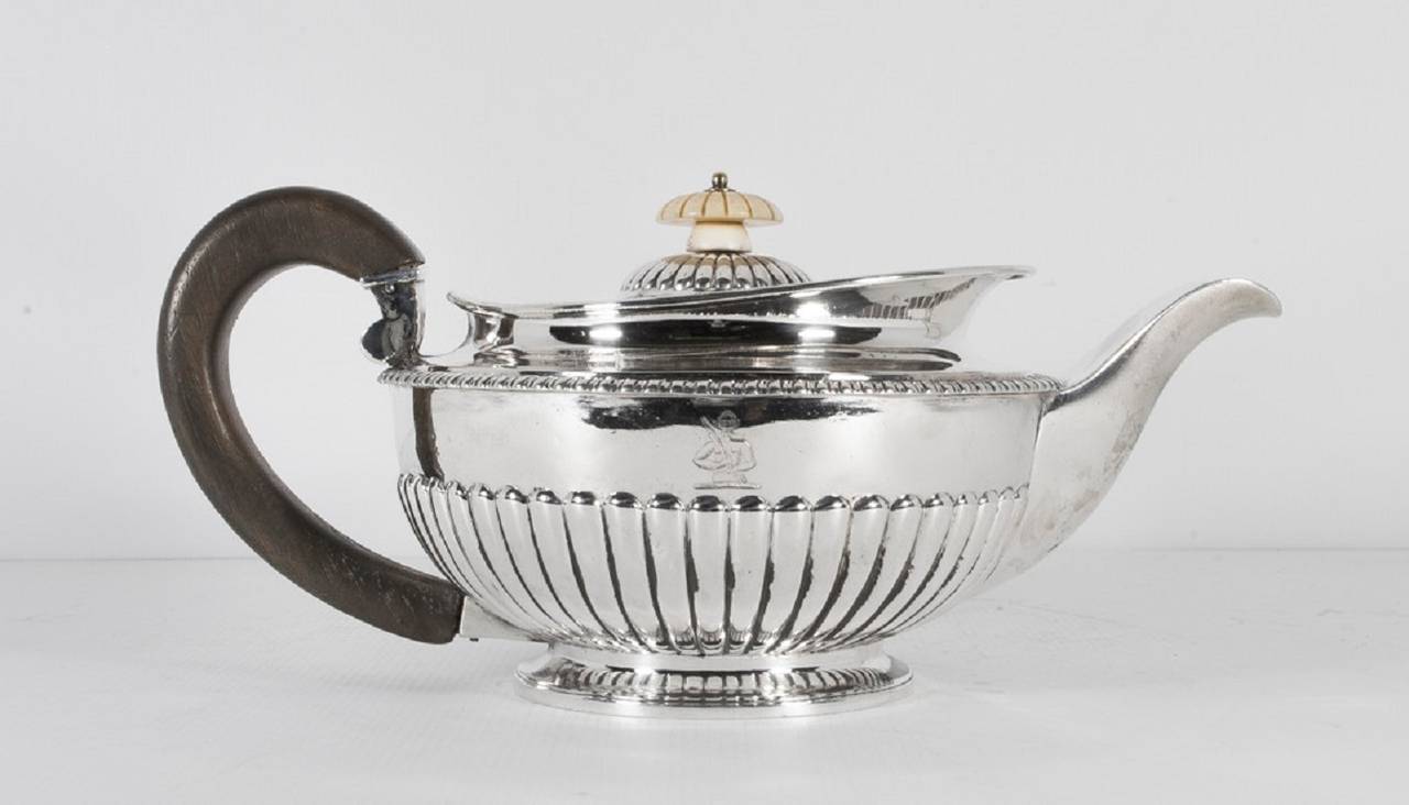 This is a wonderful antique sterling silver teapot with hallmarks for London 1813 and the makers mark of one of the most celebrated silversmiths of all time, Paul Storr. 

It is beautifully made and is a fine example of his work. 

There is no