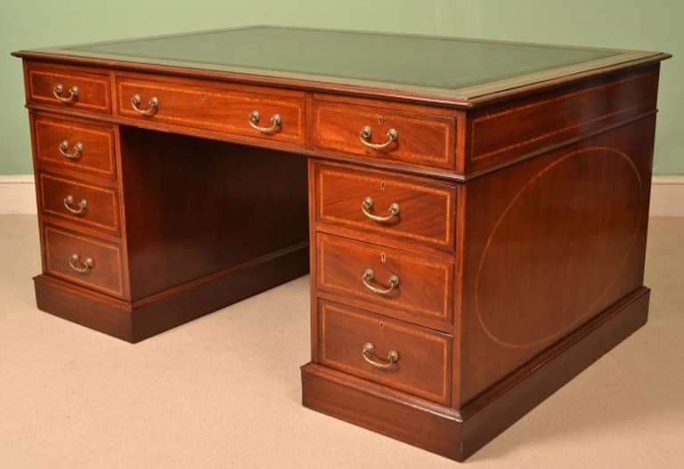 This is a stunning antique mahogany pedestal partners desk, circa 1880 in date and in excellent fully restored condition with original handles and locks.

One of the drawers bears a brass label for 'Druce & Co' Upholsterers & Cabinet Makers, Baker