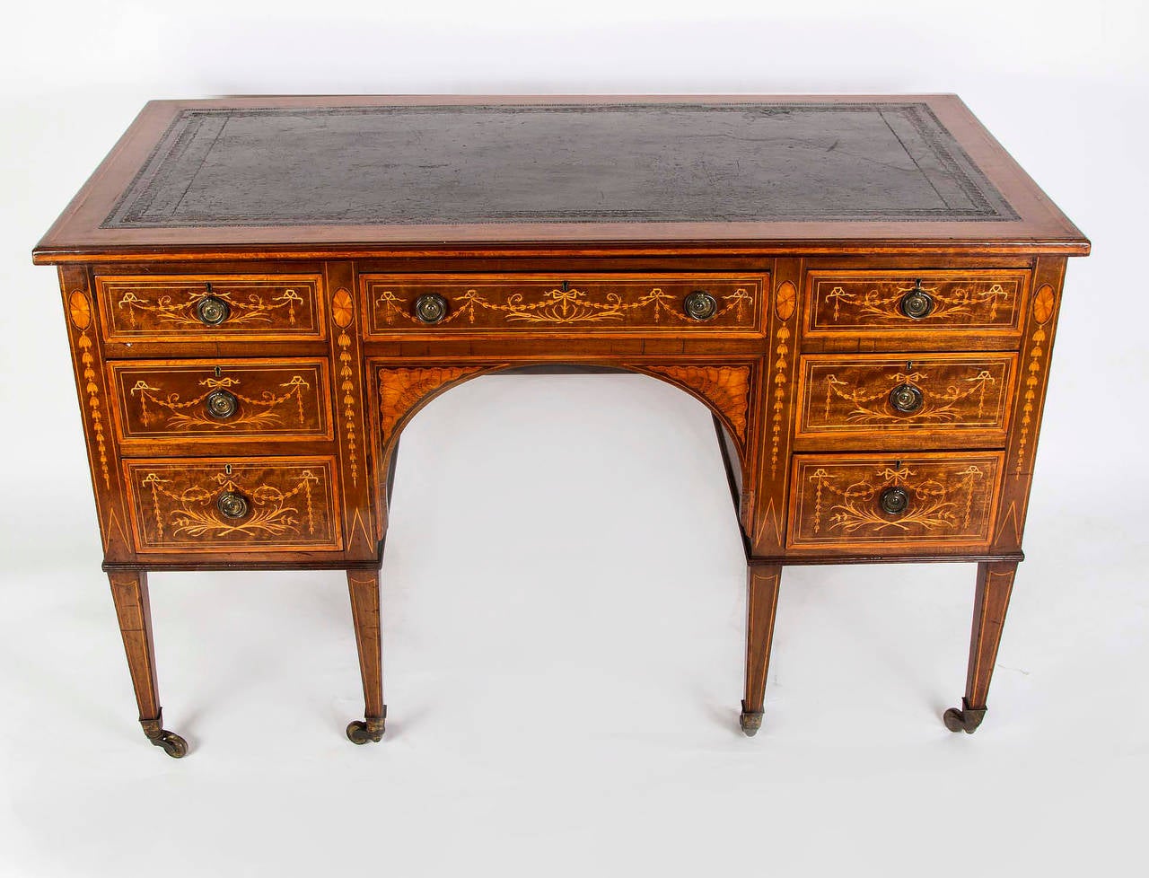 This is a stunning antique Edwardian pedestal desk, circa 1890 in date. 
The desk bears the impressed stamp of the renowned cabinet maker James Shoolbred & Co. 

It has its original leather writing surface with hand tooled gold leaf