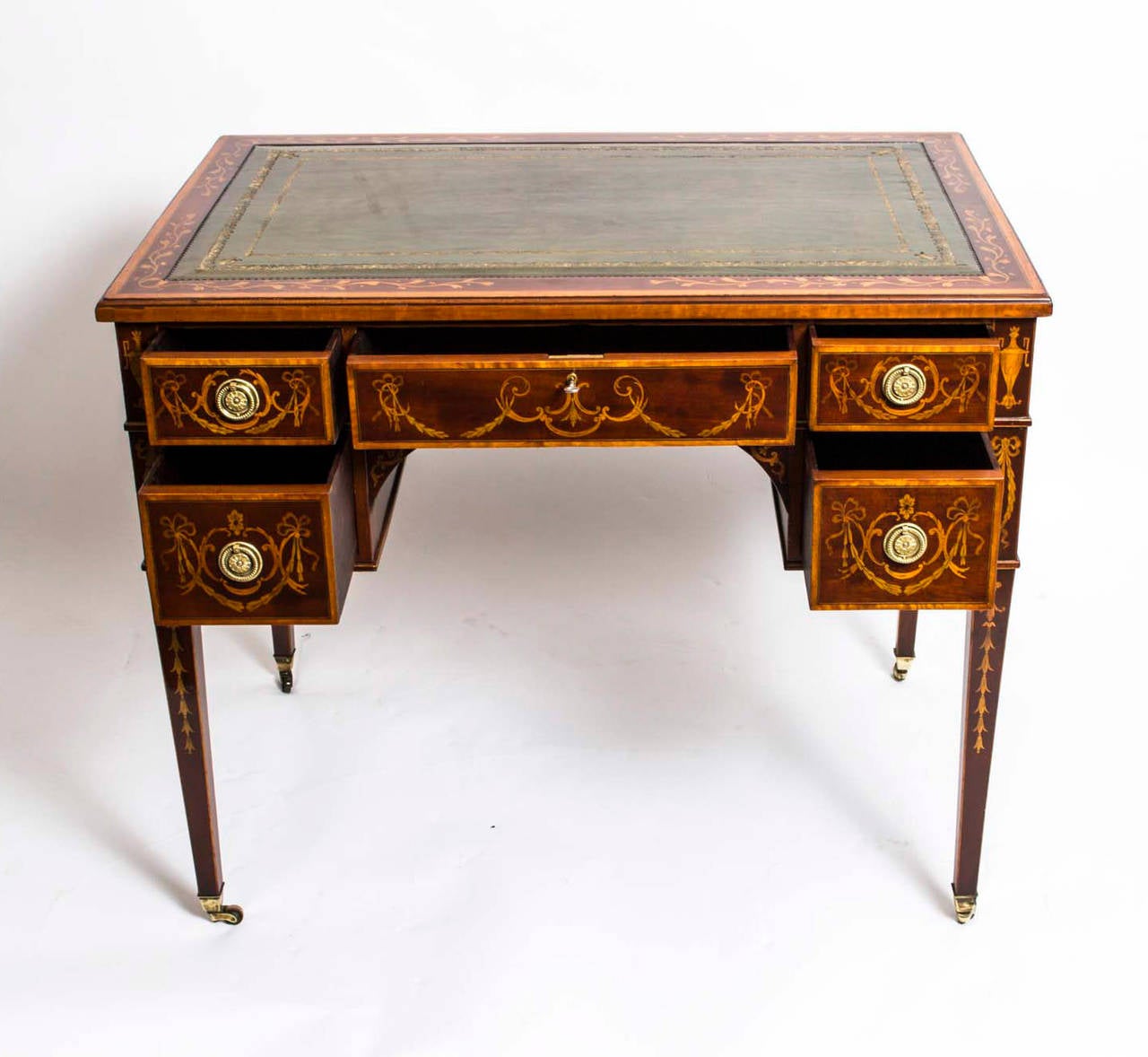 This is a stunning antique writing desk which is crafted from the most beautiful mahogany with fabulous inlaid marquetry decoration, circa 1900 in date. 

It has been wonderfully inlaid by a master craftsman and the quality of the work is