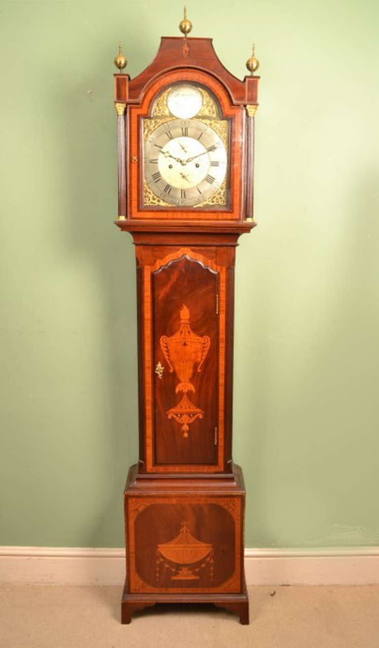 This is a lovely antique George III mahogany and inlaid longcase clock circa 1780 in date.
It is an 8 day clock with silvered chapter ring and it is signed 