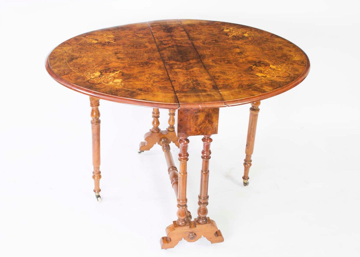 This is a delightful antique Victorian inlaid burr walnut Sutherland or occasional table, circa 1860 in date. 

The base is carved from solid walnut and the top, of inlaid burr walnut, is a truly exceptional example of the Victorian cabinet