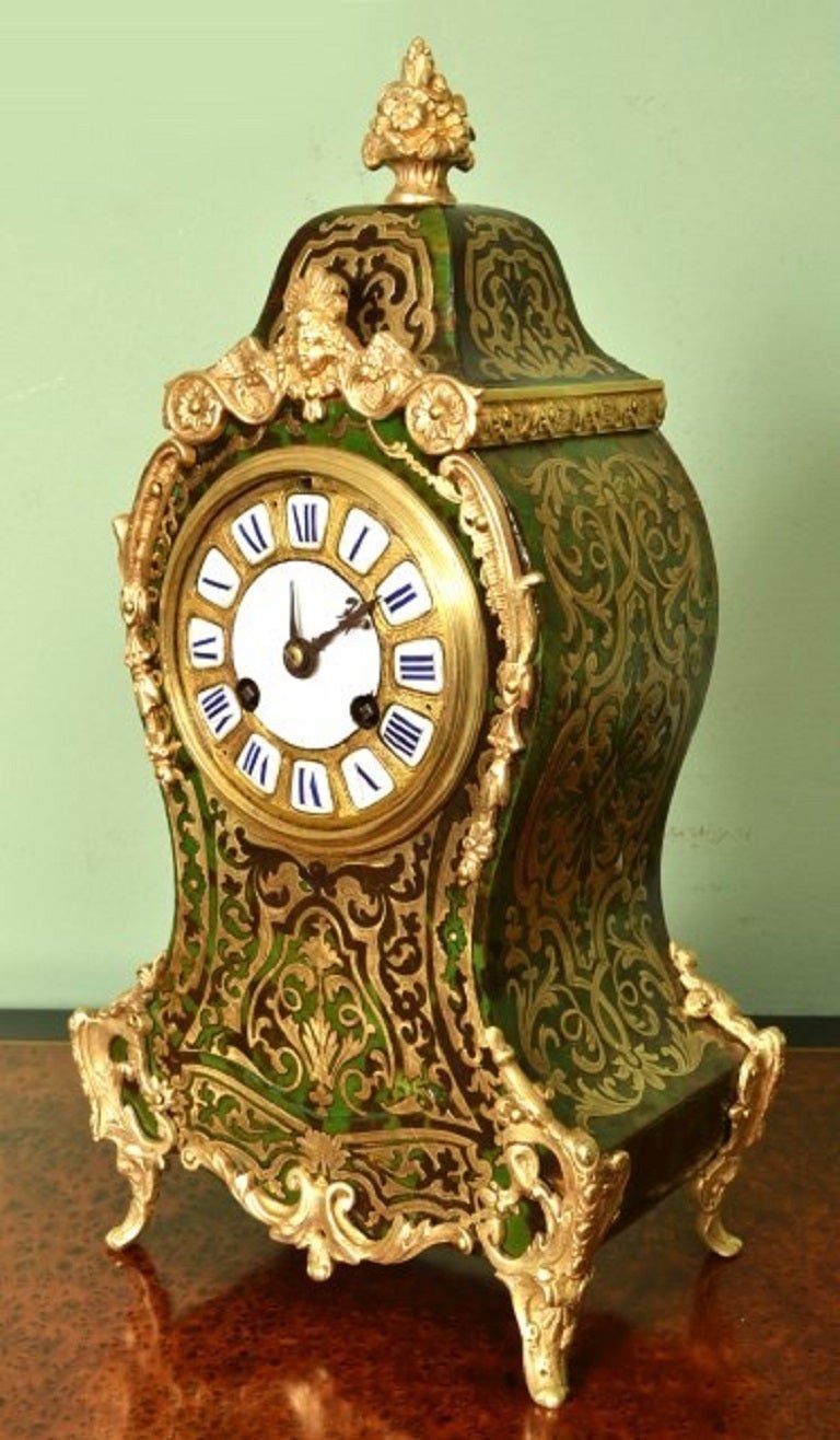 This is a beautiful antique French green Boulle mantel clock with fabulous gilded ormolu mounts, circa 1880 in date. 

The movement is signed 