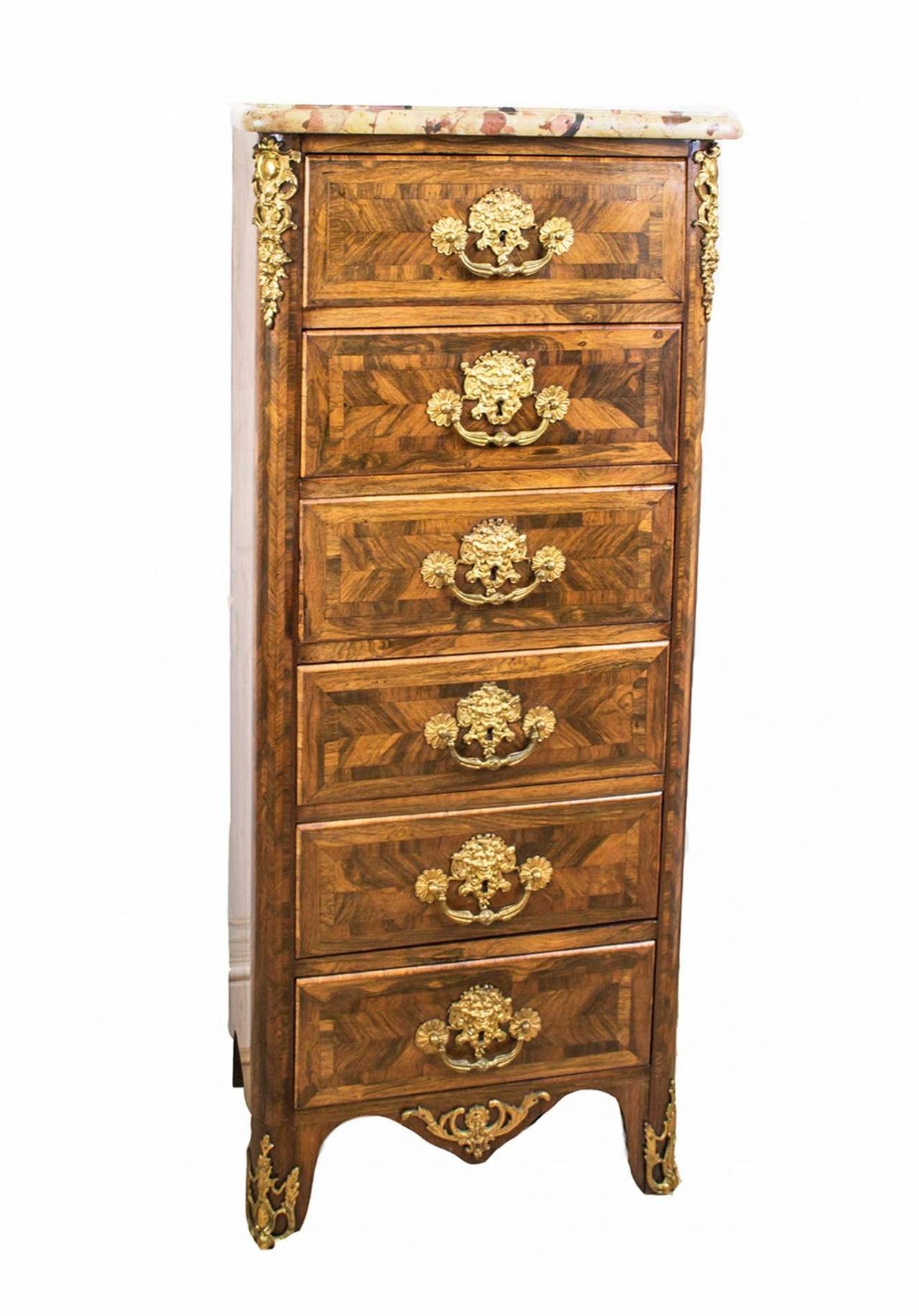 This is a beautiful antique French rosewood semainier or tall chest, circa 1860 in date. 

This piece was skillfully crafted in rosewood and features fabulous ormolu handles and mounts. 

It has six drawers all with original locks and handles.