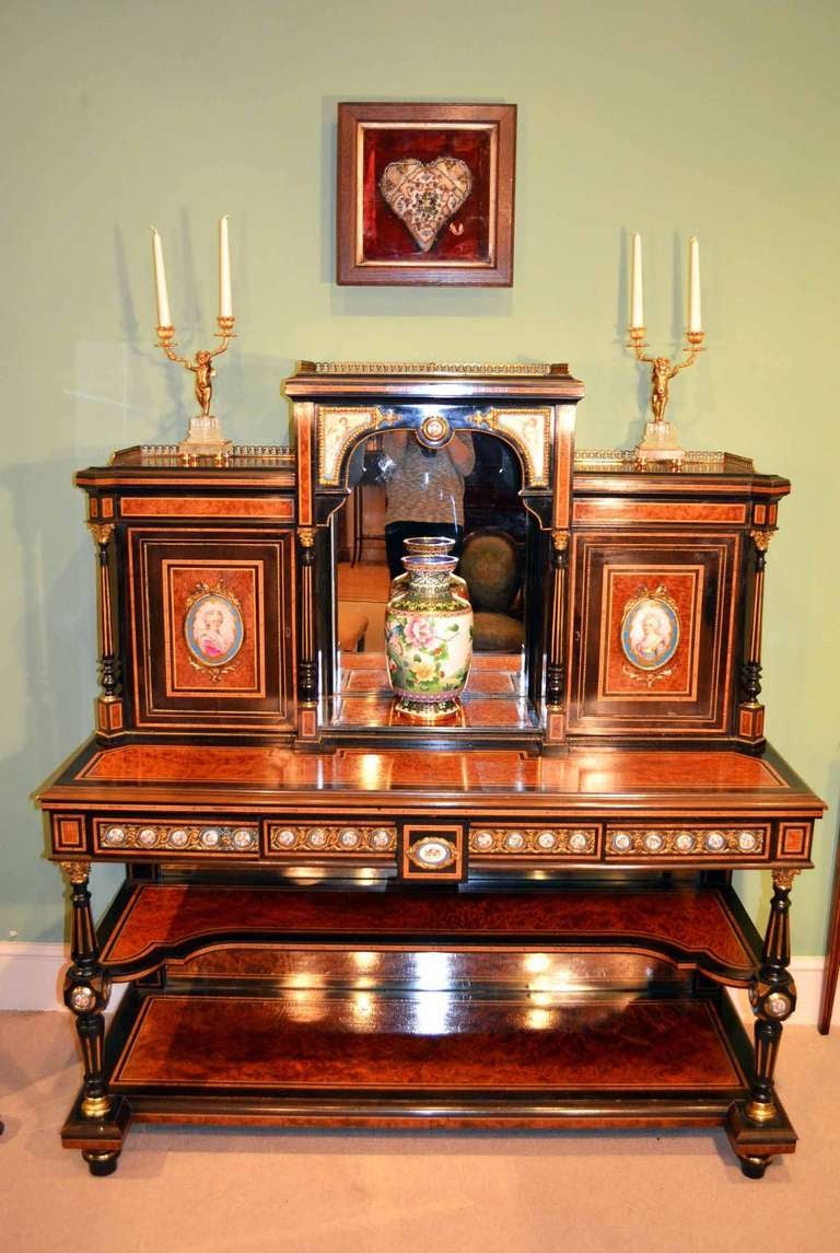 This is a gorgeous Victorian Bonheur Du Jour or Ladies Writing Desk, Circa 1860 in date.

It is made from burr walnut with hand painted Sevres porcelain plaques and exquisite ormolu mounts, it is an example of superb quality and design.

The