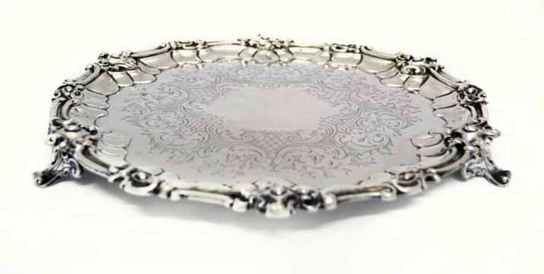 This is a wonderful antique English Victorian sterling silver salver.

It has hallmarks for London 1854 and the makers mark of George Angell.

It is typical of his work with the exquisitely detailed rim and feet and marvellous