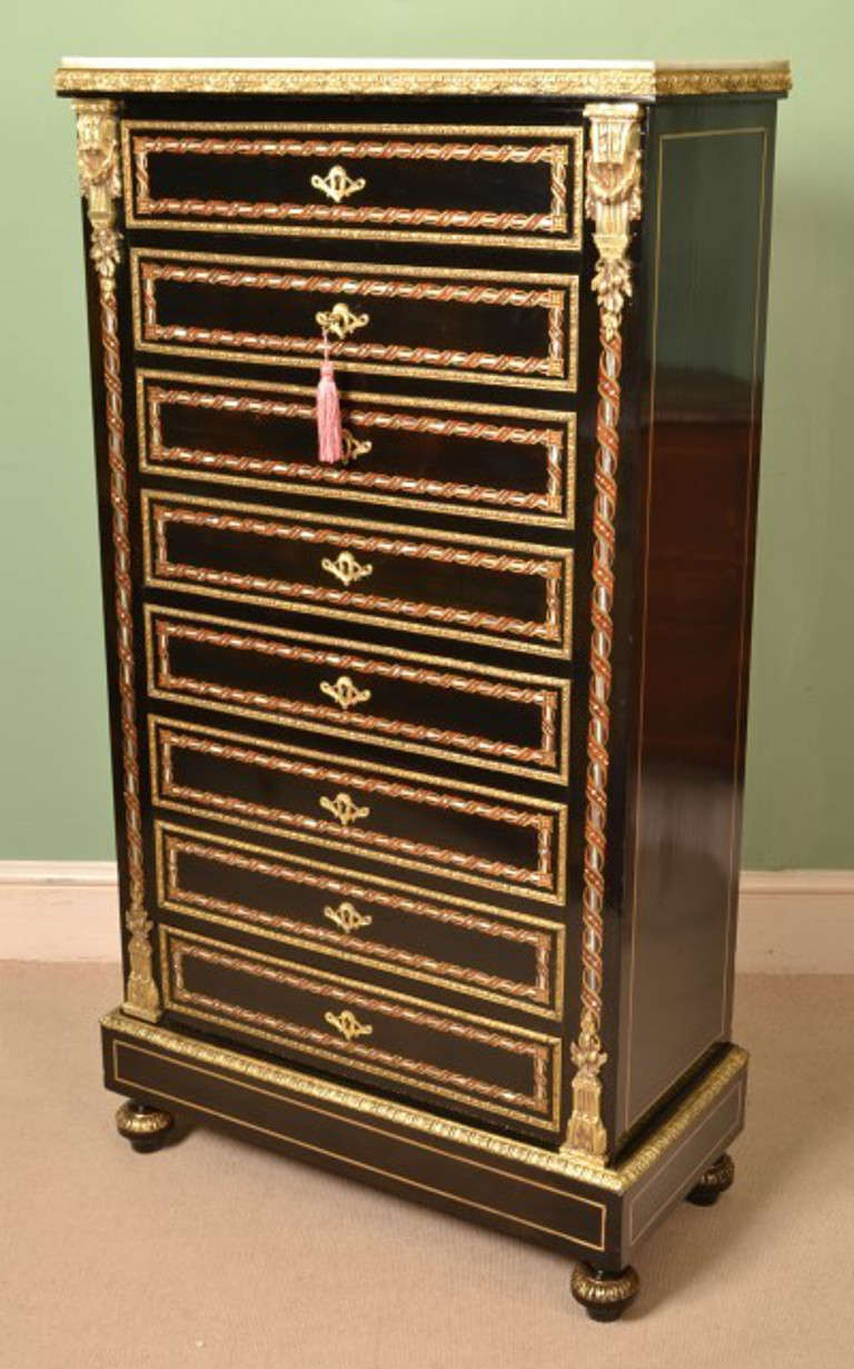 This is a beautiful antique French ebonised and brass inlaid Secretaire a Abattant, C 1880 in Louis XV style.

This fabulous piece has beautiful Mother of Pearl, rosewood and brass marquetry decoration with fabulous ormolu handles and mounts. The