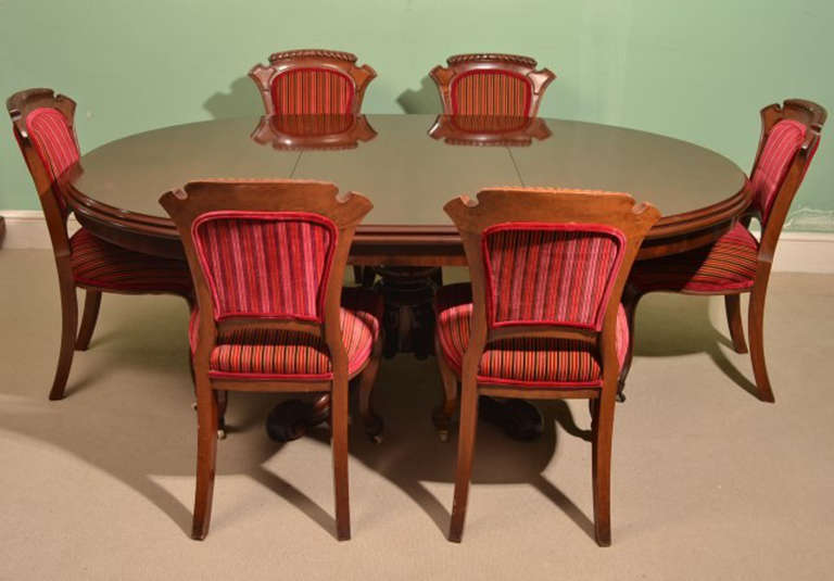There is no mistaking the style and sophisticated design of this exquisite English antique Victorian solid mahogany dining set, Circa 1860 in date.

It comprises an extending dining table and matching set of six chairs. This set will stand out in