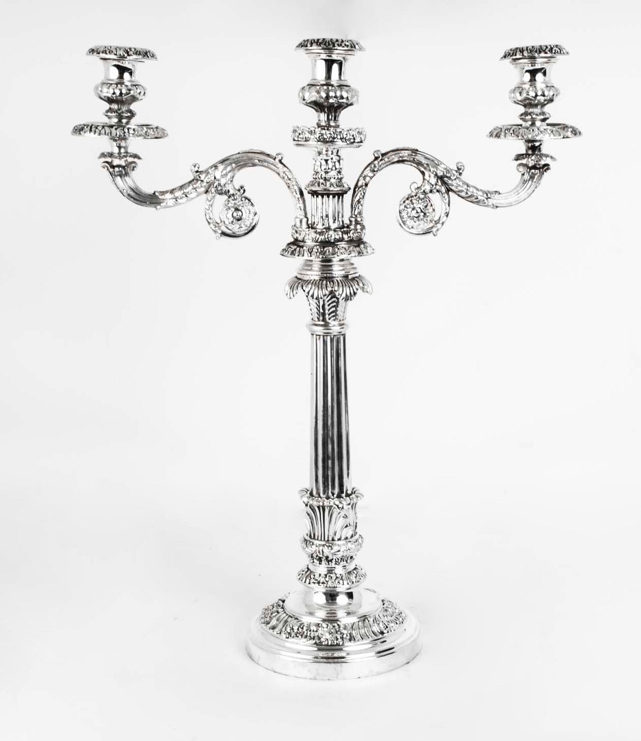 This is a fabulous large pair of antique Regency three light silver plated Old Sheffield candelabra circa 1820 in date. 

They are very elegant and have detachable sconces, the top part can be detached by unscrewing it from the candlestick, and if