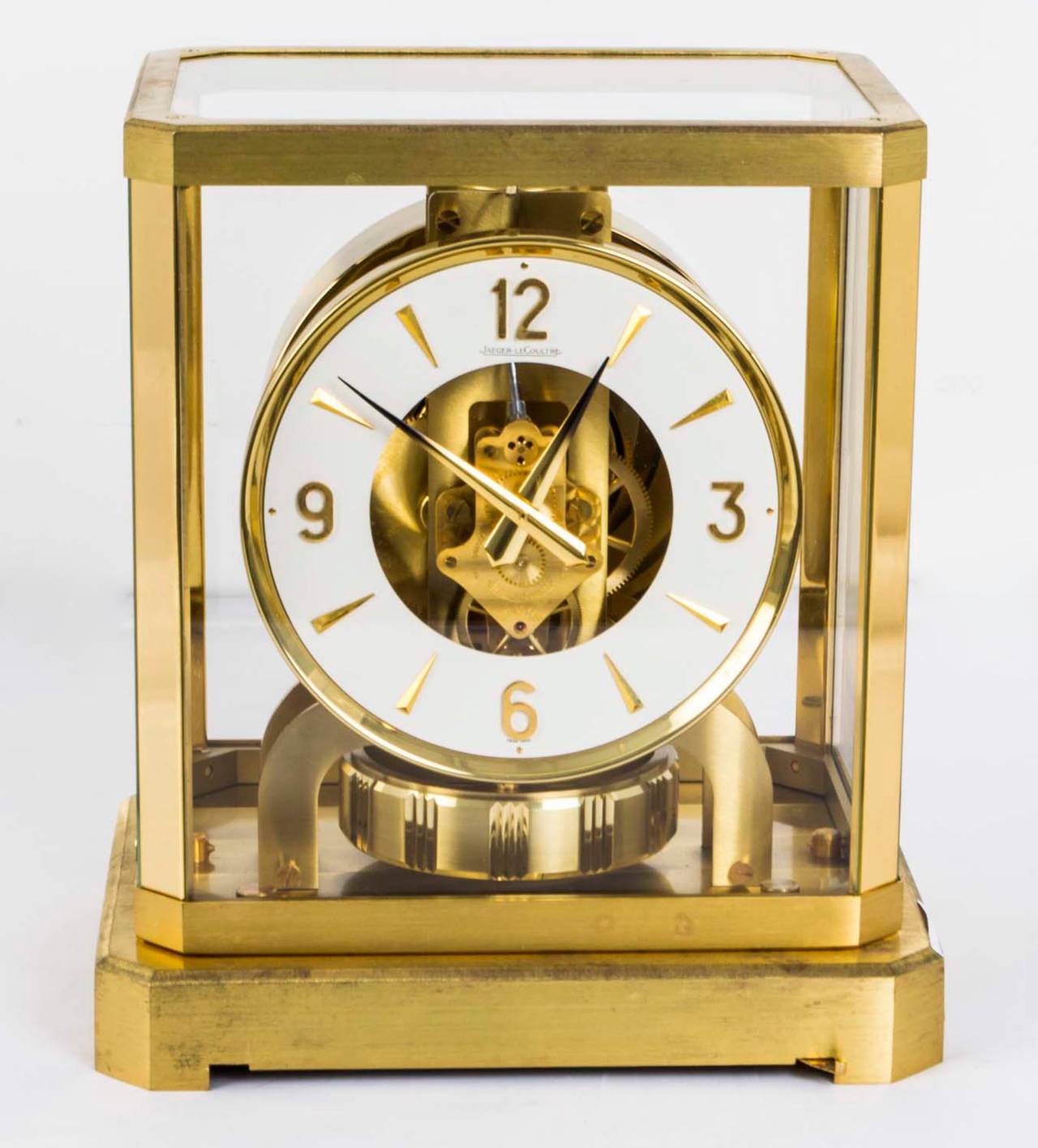 This is beautiful and very decorative Vintage Atmos mantle clock by Jaeger-LeCoultre. 

The clock is displayed in a polished gilt rectangular brass case and the glass door still has the bold LeCoultre etching. 

The clock self-winds and keeps
