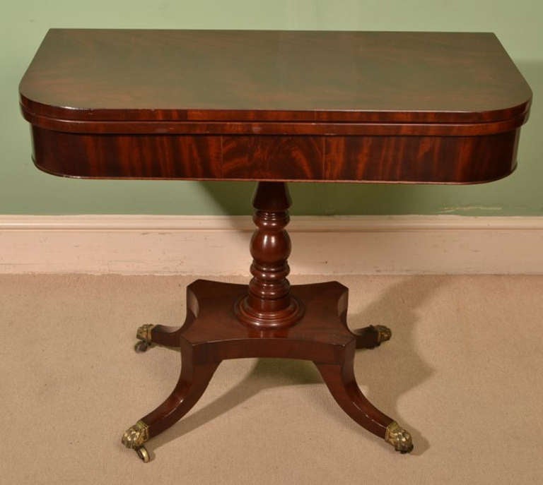 This is a sublime antique Regency mahogany card table, Circa 1820 in date.

This gorgeous card table is crafted from beautiful flame mahogany which has been French polished to highlight the beautiful grain.

The top swivels to reveal a