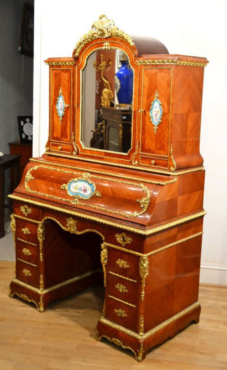 This is a gorgeous French Bureau de Dame / Bonheur du Jour, or Ladies Writing Desk and it is Circa 1850 in date. 

It is made from kingwood with hand painted Sevres porcelain plaques and exquisite ormolu mounts, it is an example of superb quality