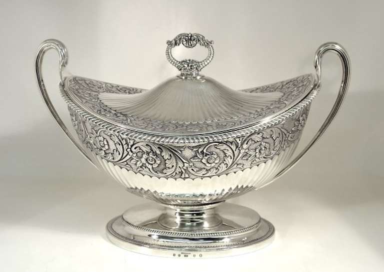 This is a beautiful antique Scottish George IV sterling silver tureen and lid, with hallmarks for Edinburgh 1823, the makers mark of the renowned Scottish silversmith Alexander Edmondston III, and the mark of the celebrated retailer Forresters. It