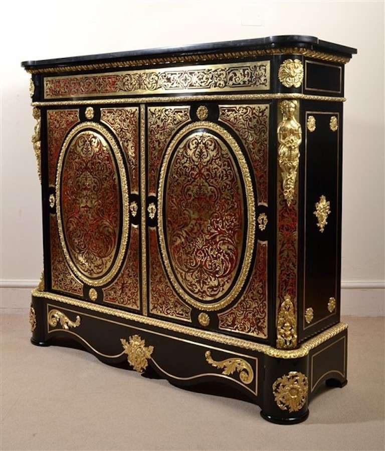 This is a beautiful antique ebonized cut brass Boulle and tortoiseshell two door pier cabinet, circa 1840 in date

This ornate cabinet is decorated with ormolu mounts and has an elegant 