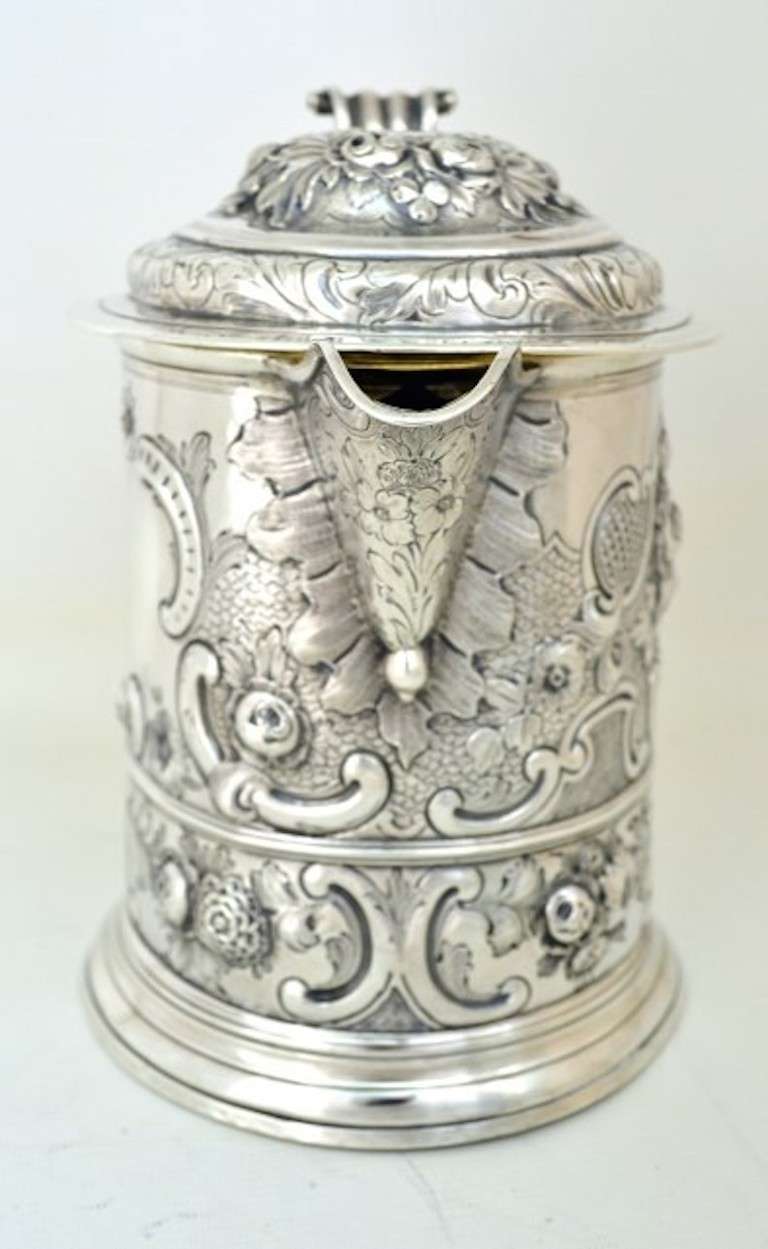 This is a wonderful large antique English George I sterling silver tankard with spout, which bears hallmarks for London 1719 and the makers mark of Samuel Wastell. Samuel Wastell was a well known silversmith based in London. Examples of his work can
