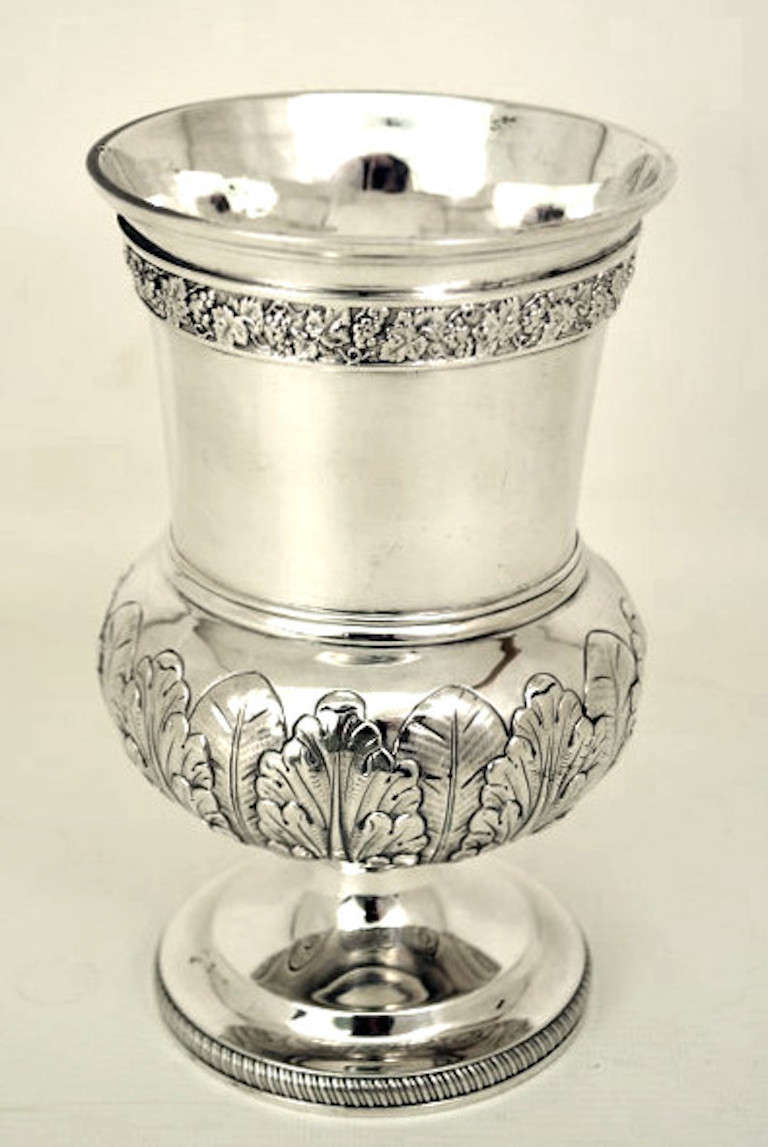This is a wonderful English antique silver goblet by the world famous silversmith Paul Storr. It has hallmarks for London 1820, the makers mark of Paul Storr and elaborate embossed and engraved floral decoration typical of his best work.<br />
<br