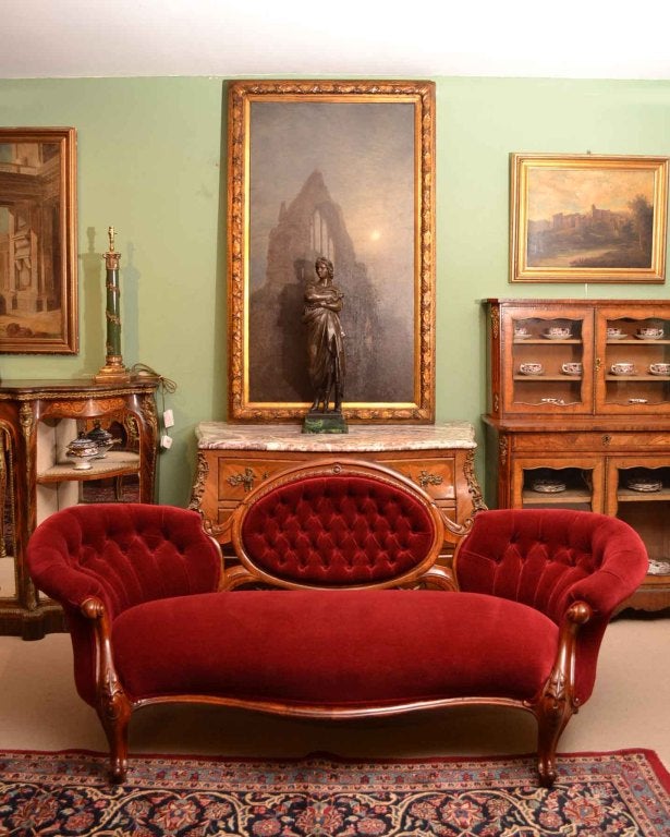 A fantastic English antique Victorian sofa which dates from around 1860.

There is no mistaking its beautiful and stylish design, which is certain to make it a treasured addition to one of the rooms in your home.

This sofa was made from hand