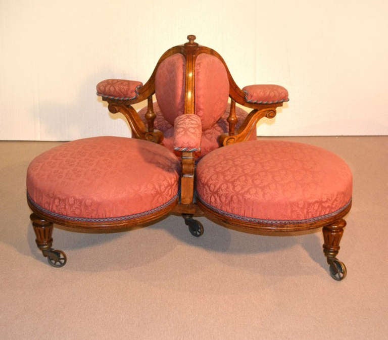 This a fantastic English antique Victorian oak conversation sofa which dates from around 1880. 

It has three individual seats with stylish carved arms and frieze. 

The settee was made from hand carved solid oak, and has beautiful patterned
