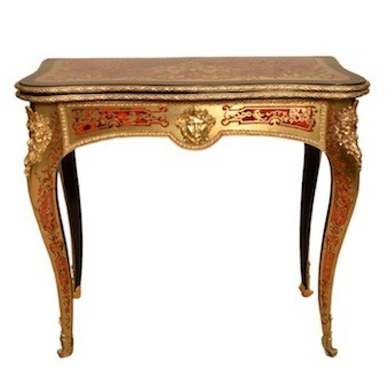 This is an absolutely stunning, antique, French red tortoiseshell and cut brass Boulle and ebonised card table with ormolu mounts, circa 1870 in date. 

The table is beautifully inlaid in cut brass on tortoiseshell with a plethora of exquisite