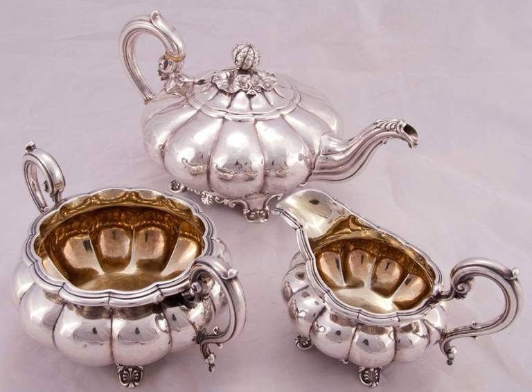 This is a lovely antique William IV three piece sterling silver tea set with the hallmarks for the celebrated Edward Bernard & Sons silversmiths dated 1828. 

The set comprises of: tea pot, sugar bowl, cream jug 

The set is of melon form with