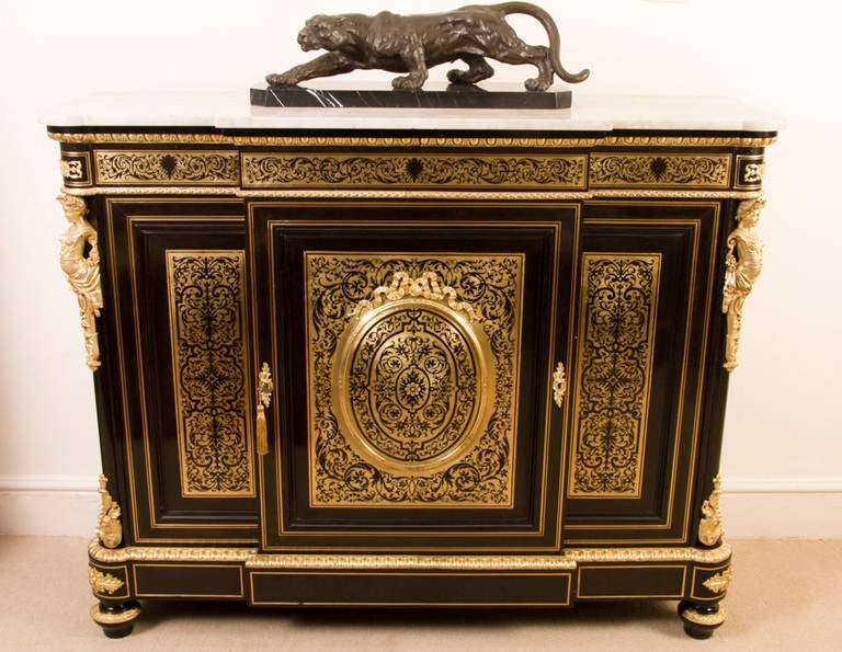 This is an absolutely exquisite, antique, Napoleon III, ebonised and cut brass Boulle marquetry, inverted breakfront side cabinet, circa 1860 in date. 

This striking credenza is profusely decorated with fabulous ormolu mounts and panels of cut