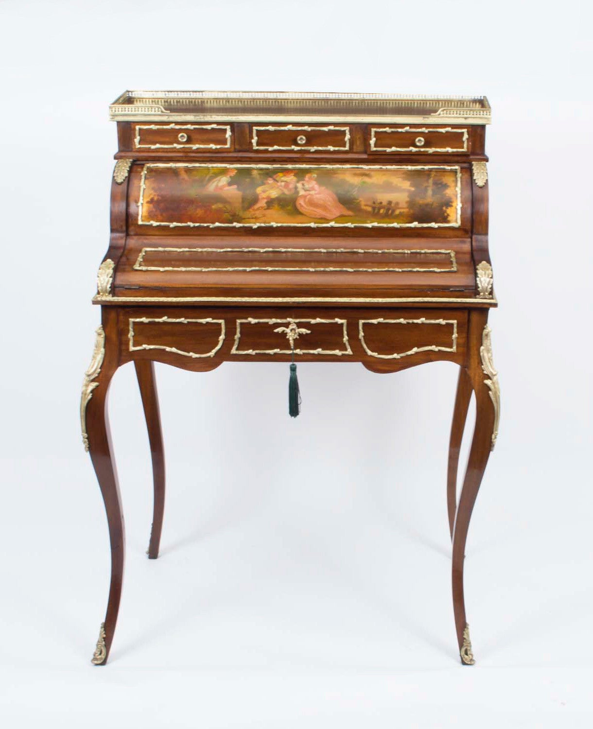This is a superb antique French mahogany and ormolu mounted Vernis Martin cylinder bureau de dame, Circa 1880 in date. 

The shaped frieze drawer opens and rotates the cylinder to reveal a mahogany three drawer interior. The cylinder is decorated