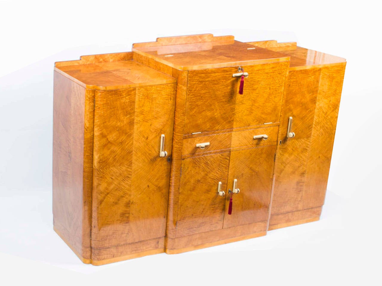 This is a fabulous antique Art Deco Period cocktail cabinet sideboard, circa 1930 in date. 

It is quite rare in that it is made of fabulous satinwood which is of the very best qualty, note the fabulous grain to the wood. 

The cabinet is of