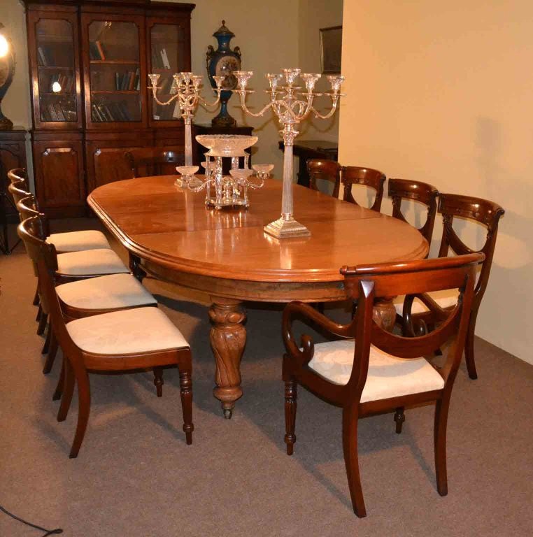 A fantastic antique Victorian dining table complete with 10 chairs.
There is no mistaking the style and sophisticated design of this exquisite  English antique Victorian  solid mahogany extending dining table, circa 1860 in date, with set of 10