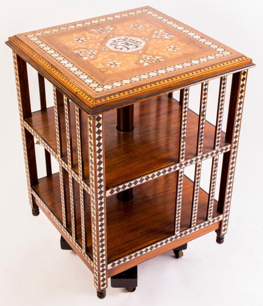 This is a fabulous antique Syrian parquetry revolving bookcase C 1880 in date. 

The exquisite inlaid marquetry and parquetry decoration is of walnut, ebony and different kinds of fruitwood all of which is complimented with beautiful mother of