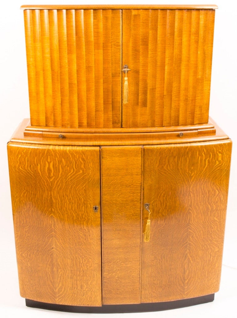 This is a fantastic antique Art Deco 'The Miramar' cocktail cabinet with maker's plaque for Rivington, London, EC2, circa 1930. 

Rivington designed and manufactured many beautiful items in the first half of the 20th century. 

The cocktail