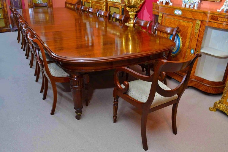 This is a rare opportunity to own an antique Victorian, solid walnut dining or conference room table, circa 1850 in date, that can seat sixteen people in comfort. 

It has six original leaves which can be added as required. The five turned legs have