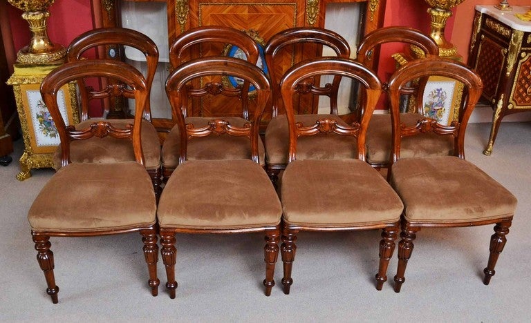 A rare set of ten Victorian walnut balloon back dining chairs, circa 1850 in date and made by Eadon and Son, of Sheffield England. They are stamped Eadon & Son Sheffield to the underside of the front seat. 

These chairs are fabulous quality and are