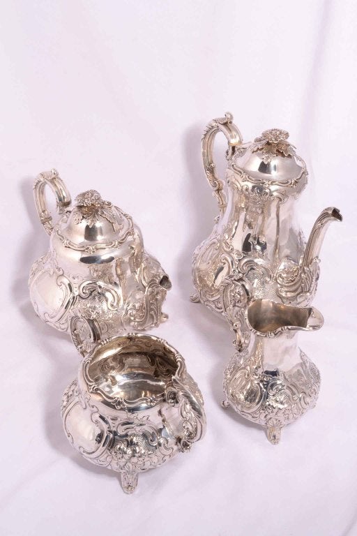 A rare and exquisite four piece antique silver four piece tea & coffee set with hallmarks for  the celebrated silversmith Henry Holland, London, 1865.

This is a truly exquisite set with fabulous and beautiful  top quality embossed decoration.