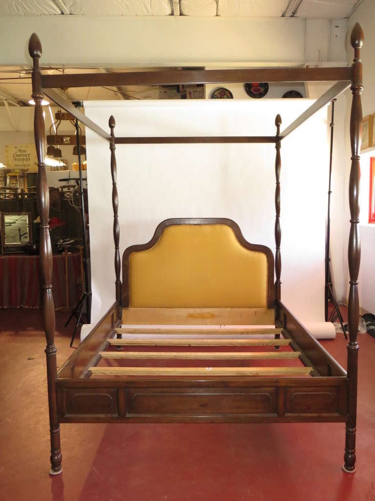 Queen size bed, headboard, foot board, side rails,and 4 posters with tester, probably pine, darkened with slats 