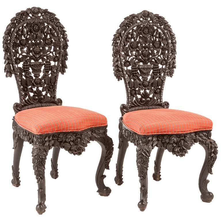 Pair carved ebony Burmese side chairs For Sale