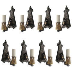 Eight Iron and Brass Sconces