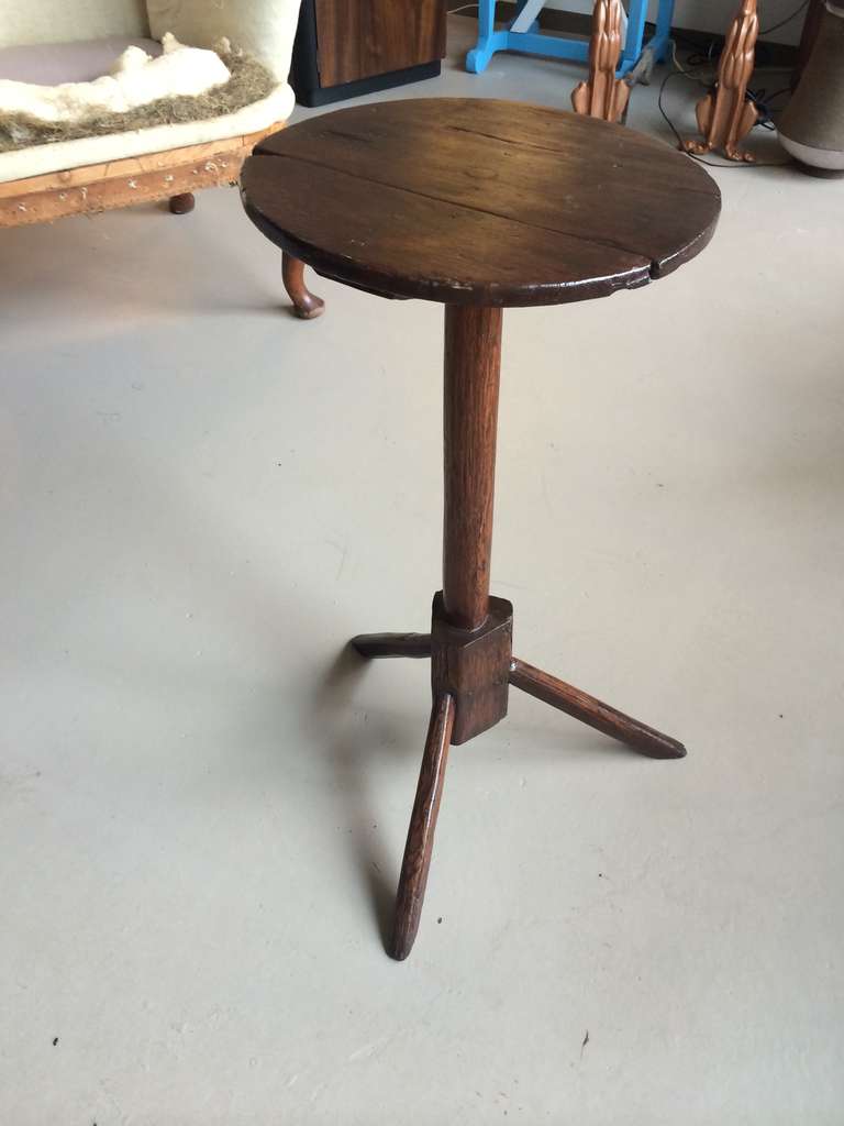 Primitive early American Oak stand with Tripod legs and round top. Discovered in the Hudson Valley of New York. A great and rare example, with solid structure and retaining its original parts. See Wallace Nuttings 