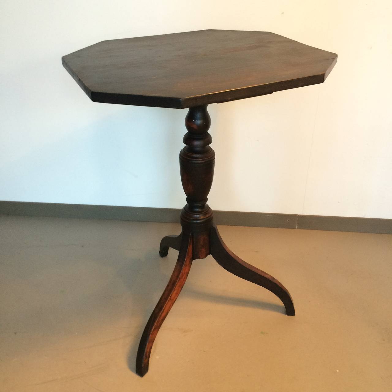 A single tripod foot Federal candle stand or side table with beautifully proportioned urn and pear turnings atop graceful spider legs. Retains a great old dark finish.