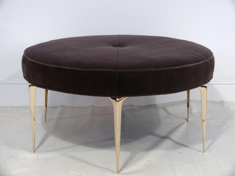 Stiletto Spider ottoman or coffee table designed by Irwin Feld Design. This versatile ottoman/coffee table features six of our hand cast and hand polished brass sculptural 