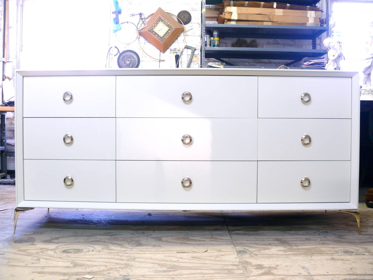 Stiletto nine-drawer dresser by Irwin Feld Design for CF Modern. Shown in BM white dove high gloss lacquer and polished solid brass hardware. This dresser can be customized to your perfect specifications. Shown lacquered, CF Modern offers many other